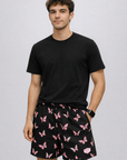 Man wearing a black t-shirt and RF-Wear Men's Butterfly Shorts in Black/Pink