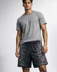 Man wearing a grey t-shirt and RF-Wear Men's Horror 2.0 Shorts in Black