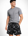 Woman wearing a grey t-shirt and RF-Wear Men's Mesh Bats Shorts in Black/Grey