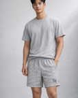 Man wearing a grey t-shirt and RF-Wear Men's Mesh Butterfly Shorts in Grey