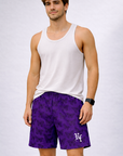 Man wearing a white tank top and RF-Wear Men's Mesh Butterfly Shorts in Purple