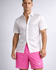 Man wearing a white dress shirt and RF-Wear Men's Mesh Checkered Shorts in Fuchsia/Pink