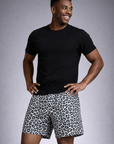 Man wearing a black t-shirt and RF-Wear Men's Mesh Animal Print Shorts - Cheetah in White