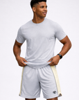 Man wearing a t-shirt and RF-Wear Men's Mesh Cream Stripe V-Cut Shorts in Grey