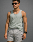 Man wearing RF-Wear Men's Mesh Cross Trim Shorts in Grey with Black Crosses Trim.