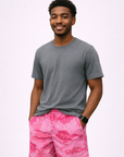 Man wearing a grey t-shirt and RF-Wear Men's Mesh Desert Camo Shorts in Pink