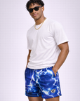 Man wearing a white t-shirt and RF-Wear Men's Mesh Lightning Shorts in Blue