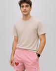 man wearing a t-shirt and RF-Wear Men's Mesh One Heart Shorts in Pink