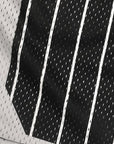 Close-up of RF-Wear Men's Mesh Pinstripe Basketball Shorts in Black/White