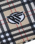 Close-up of RF-Wear Men's Mesh Tartan Plaid Shorts in Tan/Black with RF logo