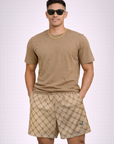 Man wearing a tan t-shirt and RF-Wear Men's Mesh Monogram Shorts in Tan/Brown