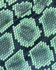 Close-up of RF-Wear Men's Mesh Snakeskin Shorts in Green