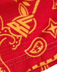 Close-up of RF-Wear Men's Mesh Split Paisley Shorts in Red/Gold with RF logo