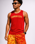 Man wear a red tank top with KANSAS CITY written in gold on the front and RF-Wear Men's Mesh Split Paisley Shorts in Red/Gold
