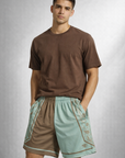 Man wearing a brown t-shirt and RF-Wear Men's Mesh Split Porcelain on the Side Shorts in Seacrest/Incense