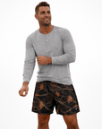 Man wearing a grey shirt and RF-Wear Men's Mesh Tree Camo Shorts Night