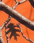 Close-up of RF-Wear Men's Mesh Tree Camo Shorts in Orange