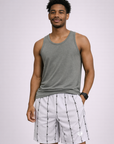 Man wearing a grey tank top and RF-Wear Men's Reflective Logo Barbed Wire Shorts in White