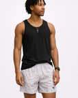 Man wearing a black tank top and RF-Wear Men's Snakeskin Shorts in Cream/Grey