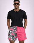 Man wearing a black t-shirt and RF-Wear Men's Split Flamingo Shorts in Pink