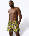 Man wearing RF-Wear Men's Swim Trunks in Pineapple Paradise