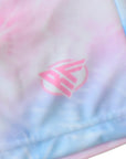 Colorful tie-dye pattern with a pink logo on a white background