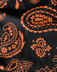 Close-up of RF-Wear Men's Mesh Paisley Shorts in Black/Orange