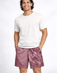 Man wearing a white t-shirt and RF-Wear Men's Split Geometric Shorts in Mauve