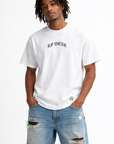 Man wearing jeans and RF-Wear Mini Print T-Shirt in White