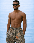 Man wearing RF-Wear Swim Trunks Tree Camo (Lined) in Tan