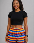 Woman wearing a black top and RF-Wear Women's Baja Shorts in Multicolors