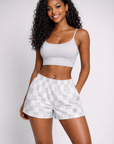Woman wearing RF-Wear Women's Checkered Shorts in Grey