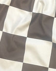Close-up of RF-Wear Women's Checkered Shorts in Mocha/Cream