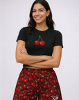 Woman wearing a black top and RF-Wear Women's Cherry Shorts in Light Red/Dark Red