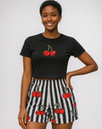 Woman wearing a black top and RF-Wear Women's Cherry Stripe Shorts in Black/White/Red