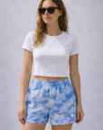 Woman wearing a white top and RF-Wear Women's Cloud Shorts in Blue