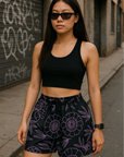 Woman on city street wearing a black crop top and RF-Wear Women's Floral Shorts in Black/Lavender