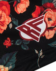 Close-up of RF-Wear Women's Floral Shorts tin Black/Red/Peach with RF logo