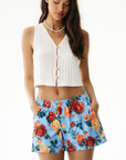 Woman wear a white top and RF-Wear Women's Floral Shorts in Sky-Blue/Multicolors