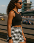 Woman at race track wearing a black crop top and RF-Wear Womrn's Houndstooth Shorts - Black/White