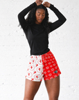 Woman wearing RF-Wear Women's Mesh Split Cupid/Heart shorts and a black top