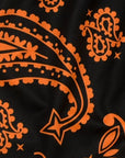 Close-up of RF-Wear women's paisley shorts in Black/Orange