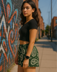 Women on sidewalk wearing RF-Wear Women's Paisley Shorts - Pine/Cream - Side View