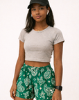 Woman wearing RF-Wear Women's Paisley Shorts in Green/White