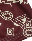 Close-up of RF-Wear Women's Paisley Shorts in Merlot/Cream with RF logo
