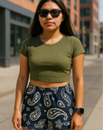 Woman on city sidewalk wearing RF-Wear Women's Paisley Shorts - Navy/Cream - Front View