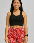 Woman wearing black top and RF-Wear Women's Paisley Shorts in Red/White