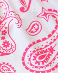 Close-up of women's paisley shorts in white/fuchsia