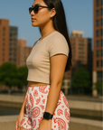 Woman standing in city wearing RF-Wear Women's Paisley Shorts - White/Red - Side View