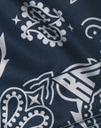 Close-up of RF-Wear Women's Split Paisley Shorts in Navy/Silver with RF logo